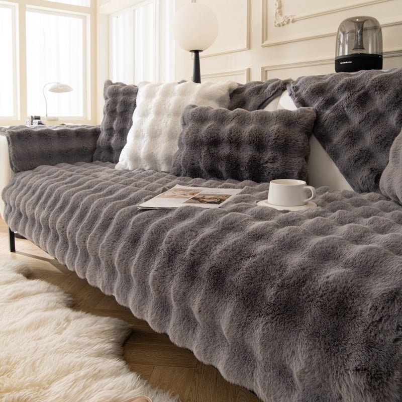 Sofa cover featuring an anti-slip design and pet-resistant material, made from durable washable fabric suitable for all sofa types. 0